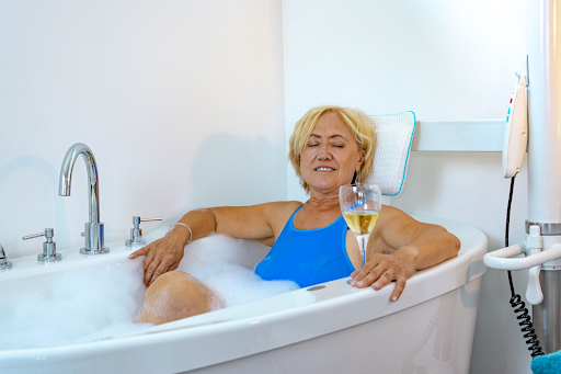 A woman using our bath chair with swivel seat